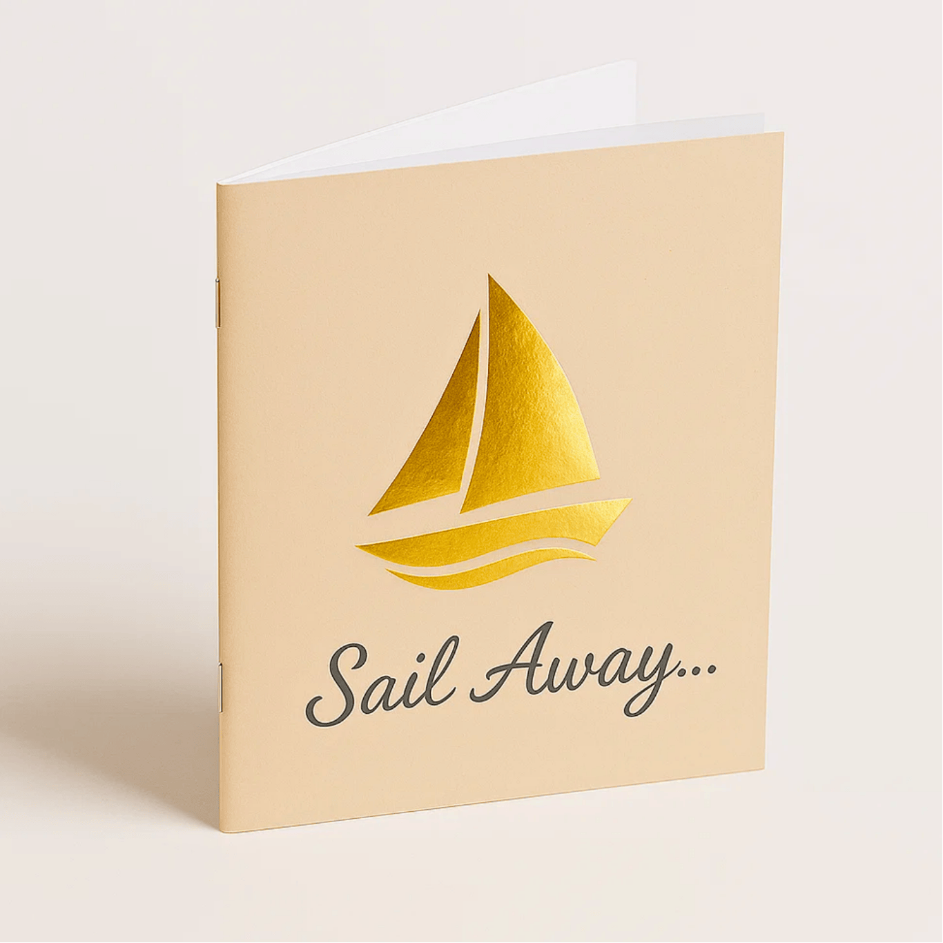 PIMG-SaddleStitchedGoldFoilSailAwayBooklet Saddle stitched booklet featuring gold foil sleeking and a unique tan paper